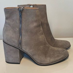 Grey Calvin Klein ankle booties with dual zippers